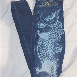 Hand bleached dragon jeans